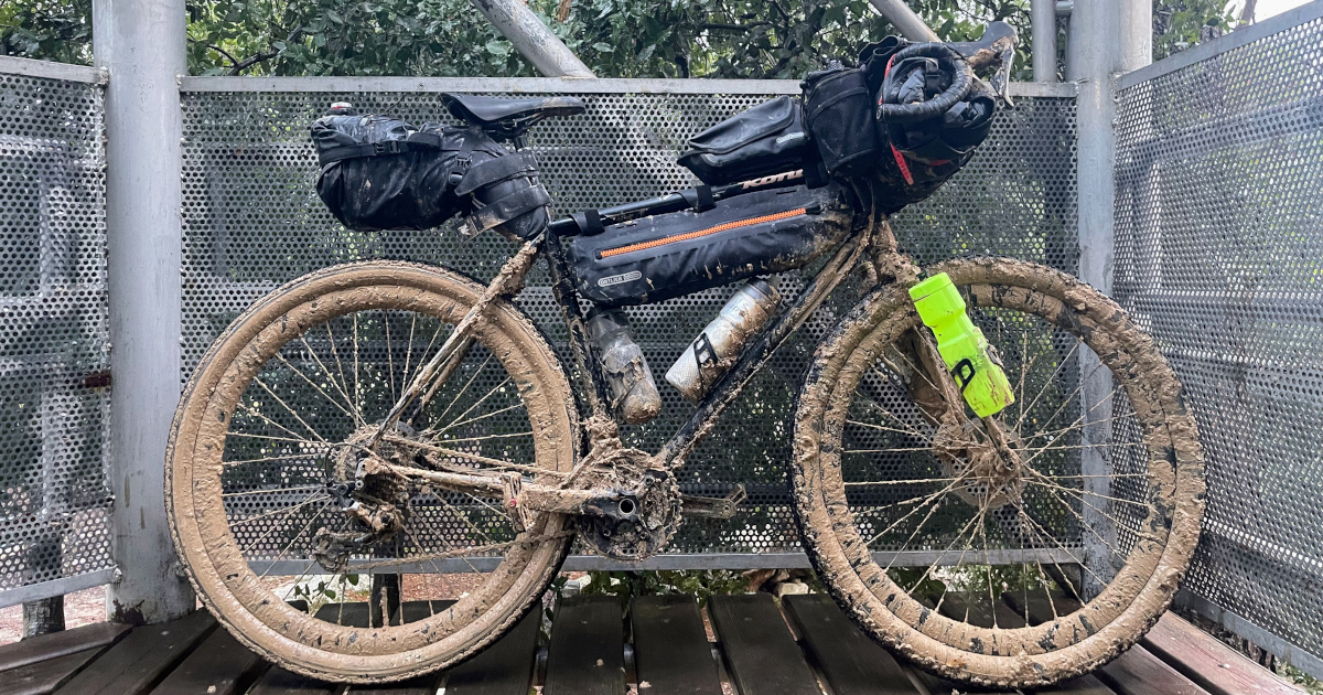 Muddy packed bike on a watch tower - Bar Giora Campsite, Israel